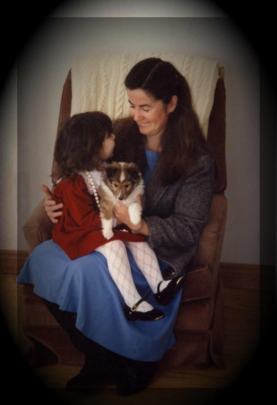 Gloria and her granddaughter with puppy.